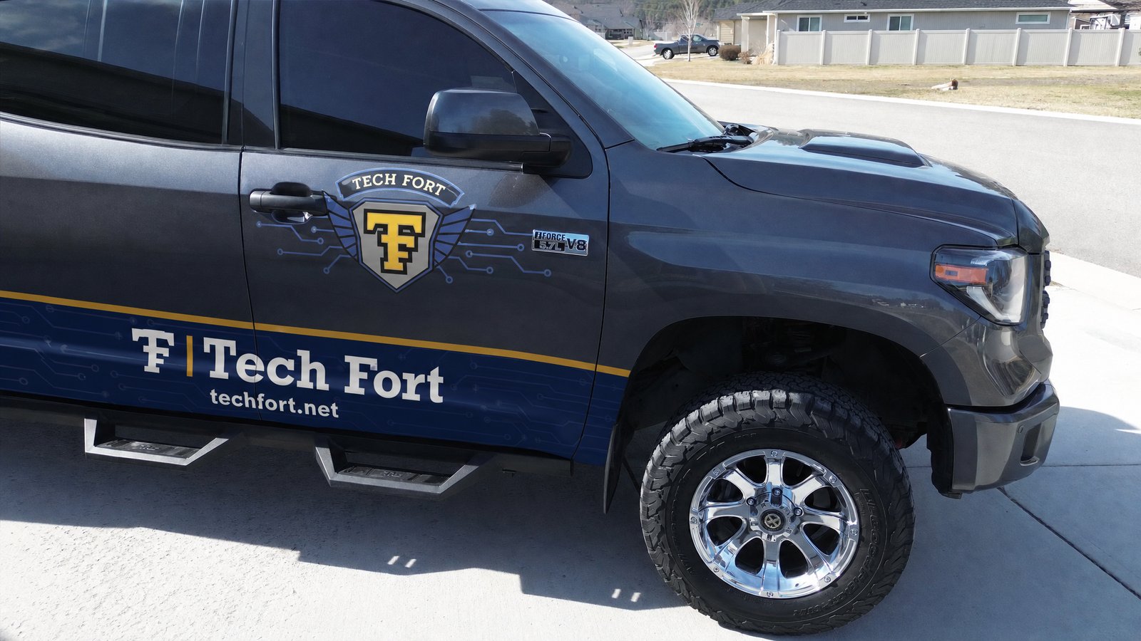 The TechFort truck - a gray Toyota Tundra with the Tech Fort shield and techfort.net on the side